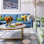 Colourful home with canvas palm tree pattern colourful blue green and jute rug overlooking ocean