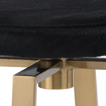 Counter stool with pony hair black top and brass base swivel contemporary design