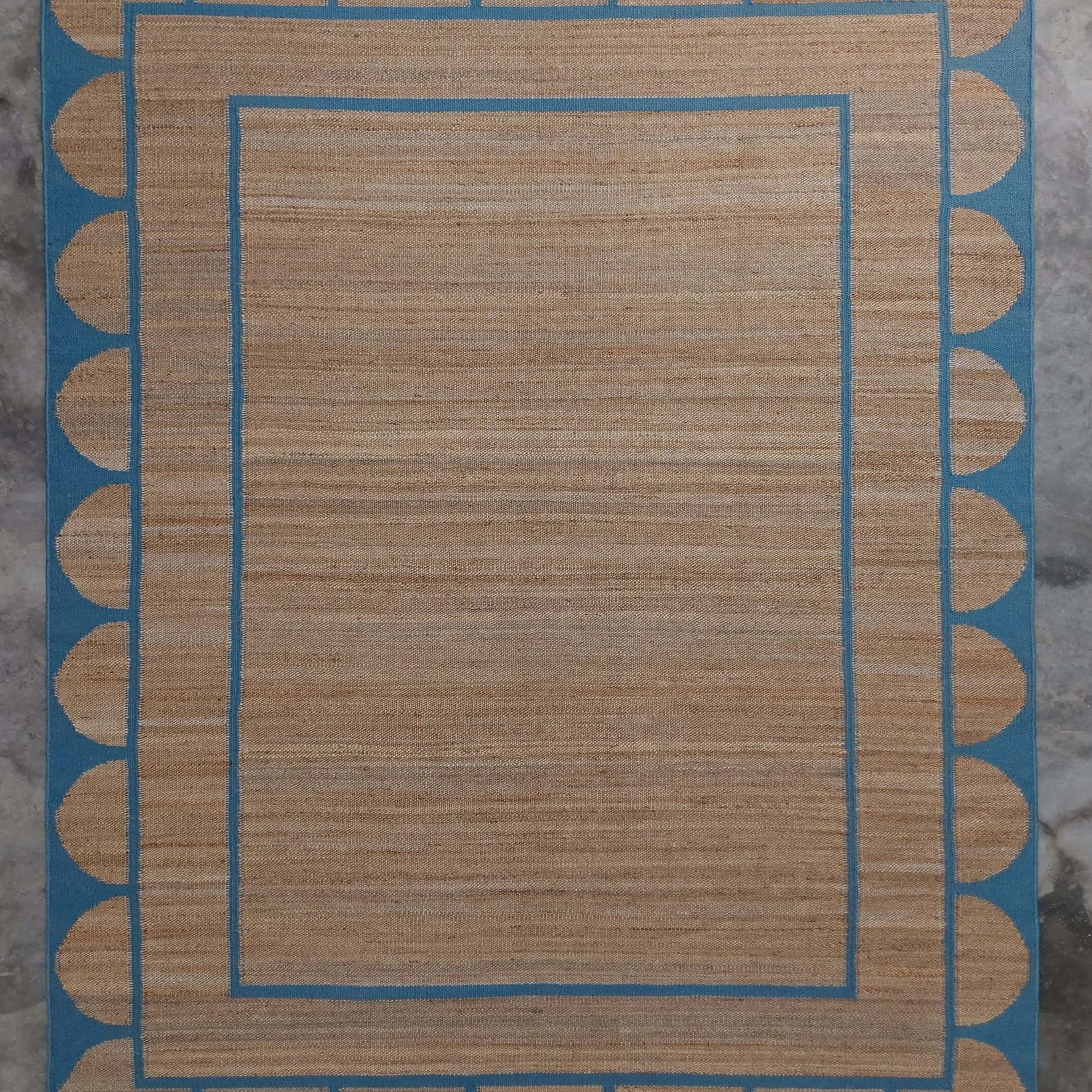Scalloped edge jute rug in blue From Jaipur with Love