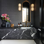 powder room, marble floor, missoni, flowers, brass accents, textured wallpaper, marble vanity