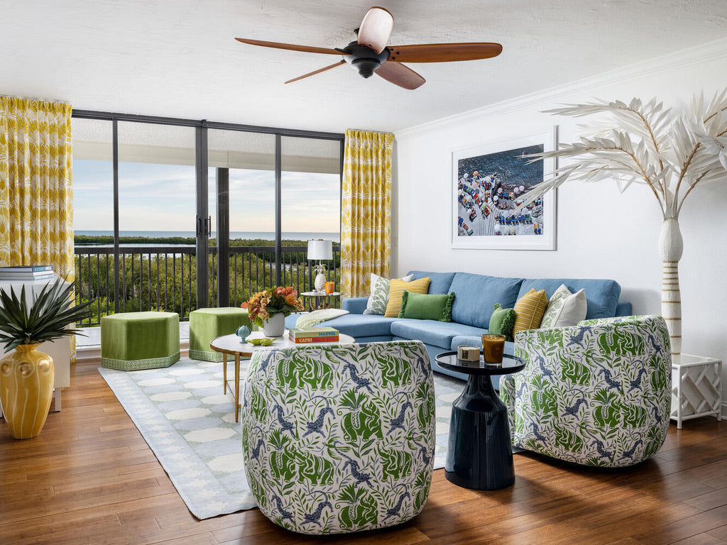 Colourful home with canvas palm tree pattern colourful blue green and jute rug overlooking ocean
