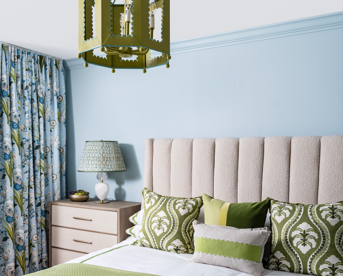 Naples Florida bedroom with blue and green Mattock scallop bedding and jute rug with scallop edge