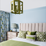 Naples Florida bedroom with blue and green Mattock scallop bedding and jute rug with scallop edge